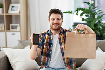 Image showing man using smartphone for food delivery