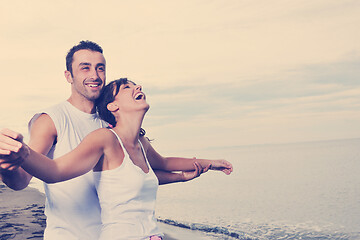 Image showing happy young couple have fun at beautiful beach