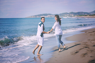 Image showing happy young couple have fun at beautiful beach