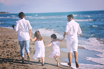 Image showing happy young  family have fun on beach