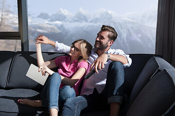 Image showing Young couple watching television