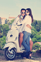 Image showing Portrait of happy young love couple on scooter enjoying summer t