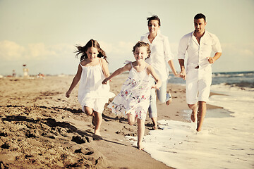Image showing happy young  family have fun on beach