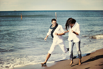 Image showing happy young couple have fun at beautiful beach