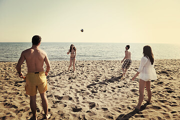 Image showing young people group have fun and play beach volleyball