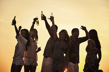 Image showing Group of young people enjoy summer  party at the beach