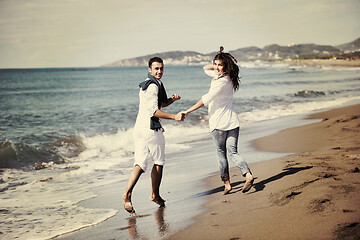 Image showing happy young couple have fun at beautiful beach