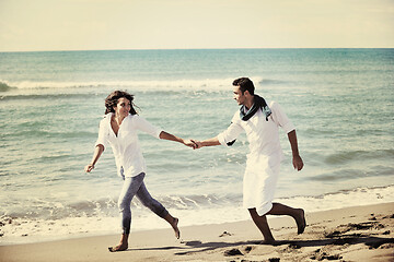 Image showing happy young couple have fun at beautiful beach