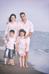 Image showing happy young family have fun on beach