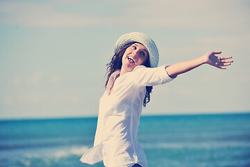Image showing happy young woman on beach