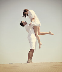 Image showing happy young couple have fun on beach