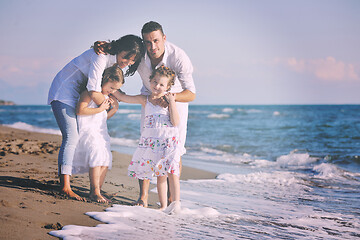 Image showing happy young  family have fun on beach