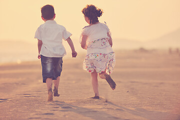 Image showing happy young family have fun on beach at sunset