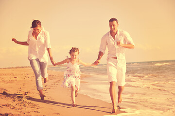 Image showing happy young  family have fun on beach