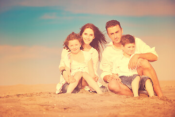 Image showing happy young family have fun on beach