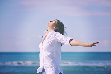 Image showing happy young woman on beach