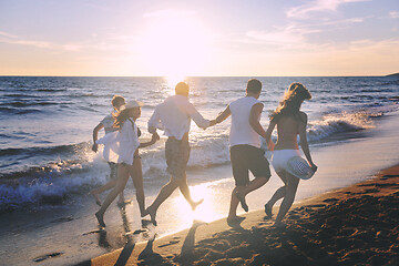 Image showing people group running on the beach