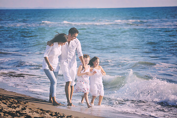 Image showing happy young  family have fun on beach