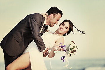 Image showing romantic beach wedding at sunset