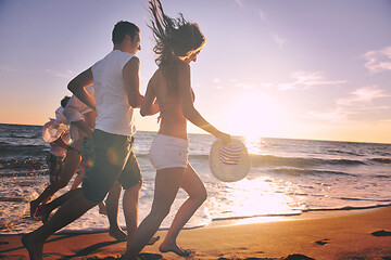 Image showing people group running on the beach