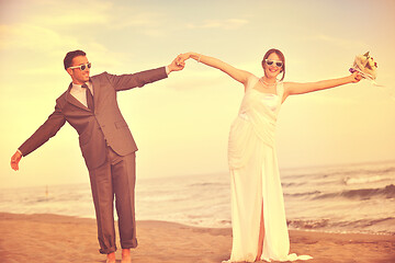 Image showing romantic beach wedding at sunset