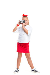 Image showing Full length portrait of cute little kid in stylish clothes with retro camera