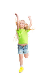 Image showing Full length portrait of cute little kid in stylish jeans clothes looking at camera and smiling