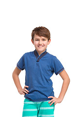 Image showing Full length portrait of cute little kid in stylish clothes looking at camera and smiling
