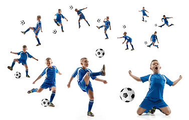 Image showing Young boy with soccer ball doing flying kick