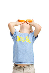 Image showing Full length portrait of cute little kid in stylish clothes with orange