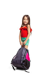 Image showing Full length portrait of cute little kid in stylish jeans clothes looking at camera and smiling