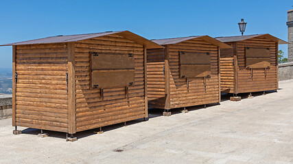 Image showing Three Wooden Kiosks