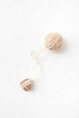 Image showing Ball of natural woolen thread on a white background. Top view.