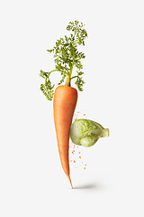 Image showing Natural cabbage as a boxing glove is punching carrot vegetable.