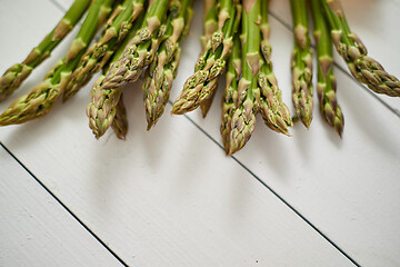 Image showing Fresh green asparagus in a brown paper bag. Healthy eating concept. Food for vegetarians