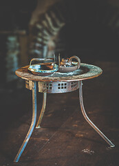 Image showing Vintage rusty table with candle holders 