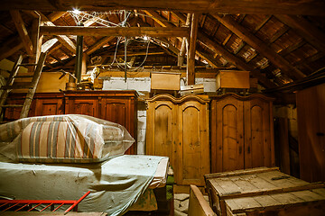 Image showing Interior of old wooden shed with scrap wood with sunrays 