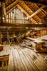 Image showing Interior of old wooden shed with scrap wood with sunrays 