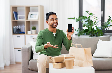 Image showing indian man using smartphone for food delivery