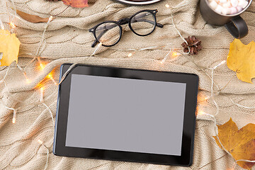 Image showing tablet pc, glasses, autumn leaves and garland