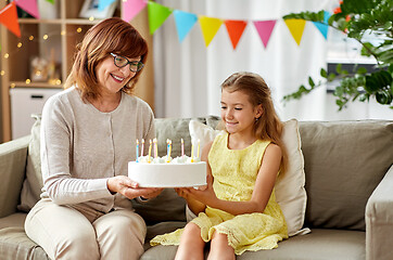 Image showing grandmother and granddaughter with birthday cake