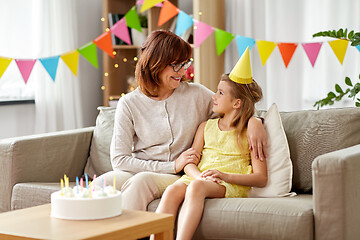 Image showing grandmother and granddaughter with birthday cake