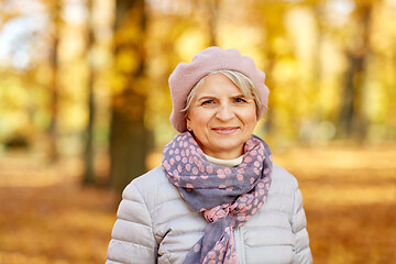 Image showing portrait of happy senior woman at autumn park