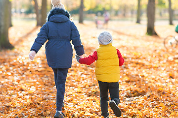 Image showing happy children running at autumn park