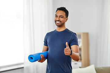 Image showing indian man with fitness tracker showing thumbs up