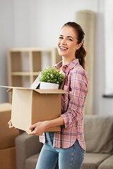 Image showing happy woman with stuff moving to new home