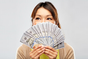 Image showing asian woman with hundreds of dollar money