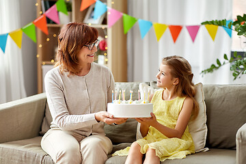 Image showing grandmother and granddaughter with birthday cake