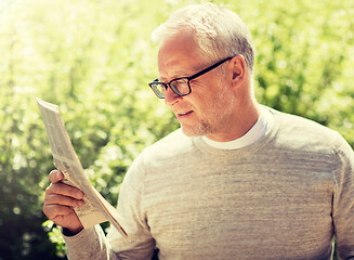 Image showing senior man reading newspaper