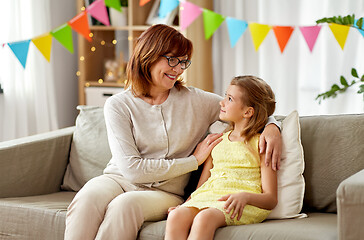 Image showing grandmother and granddaughter on birthday at home